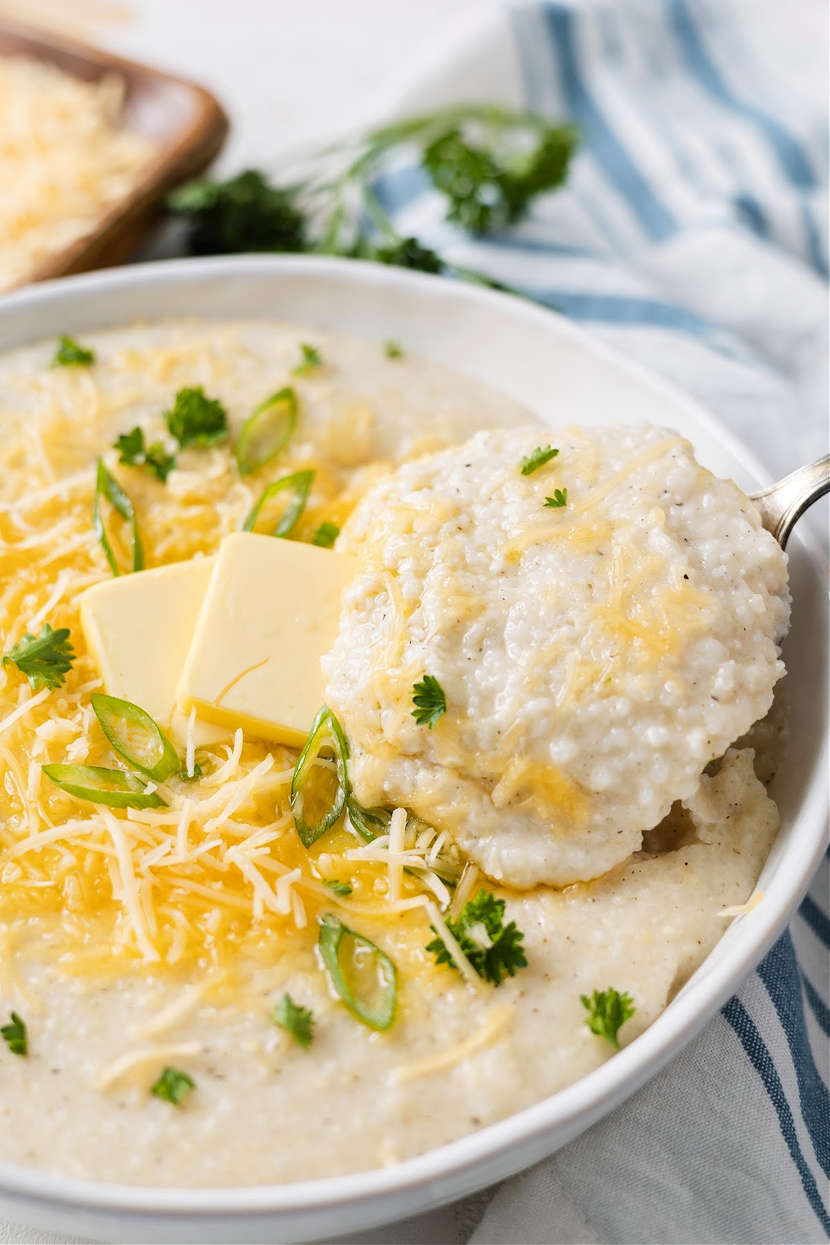 creamy southern grits in a bowl with butter and cheese