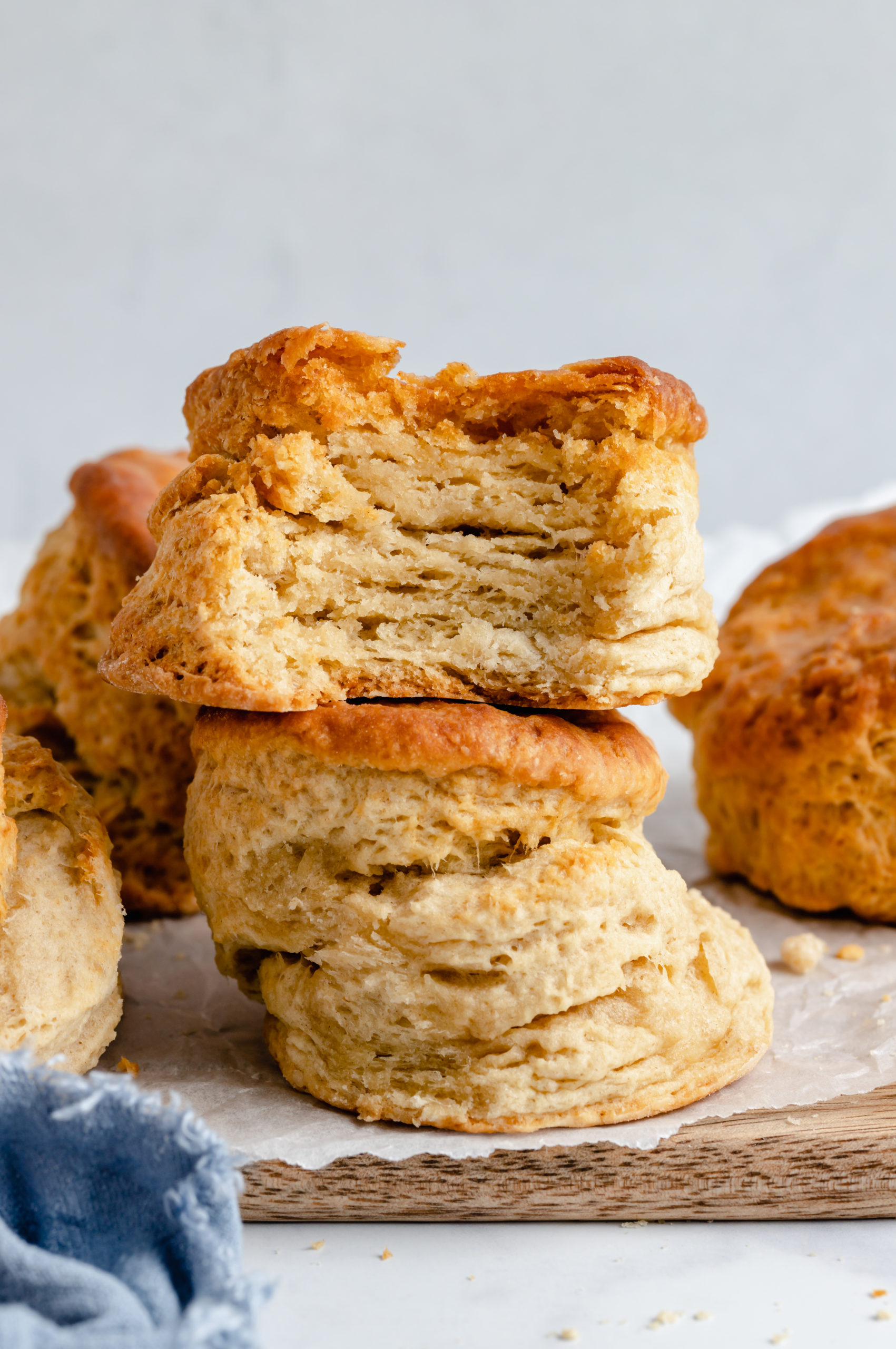 A Stack of Two Fluffy Vegan Biscuits on Top of a Slab of Wood