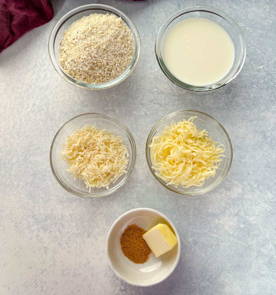 dry grits, milk, shredded cheese, Creole seasoning, and butter in separate glass bowls