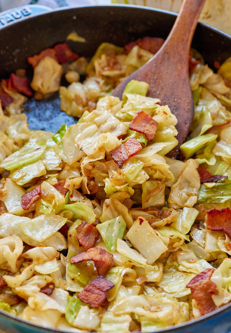 cabbage and bacon in skillet with spatula