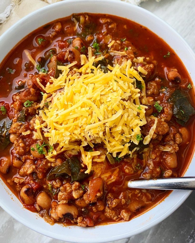 overhead shot of southern soul food chili in a white bowl