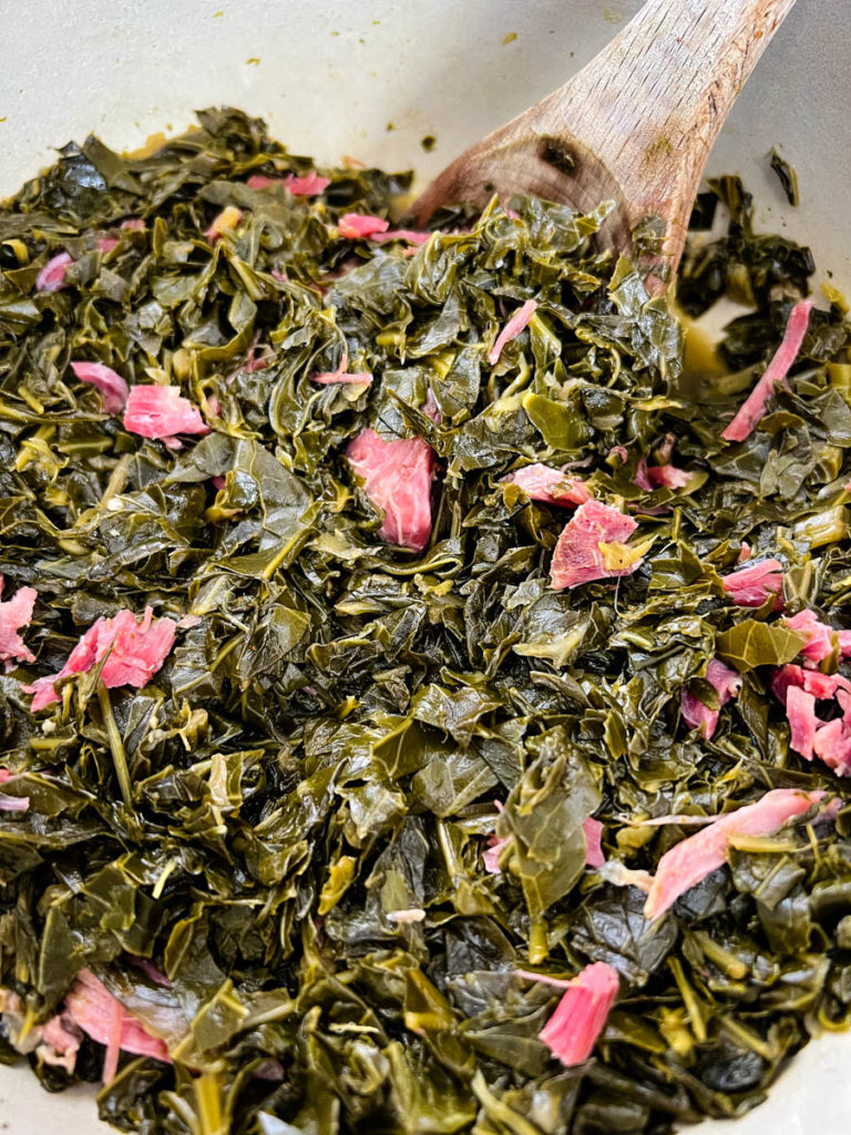 southern collard greens with ham hocks in a Dutch oven