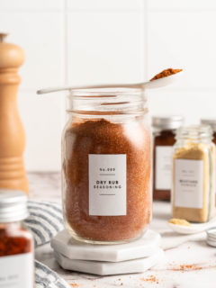 BBQ spice rub in jar with spoon set over top
