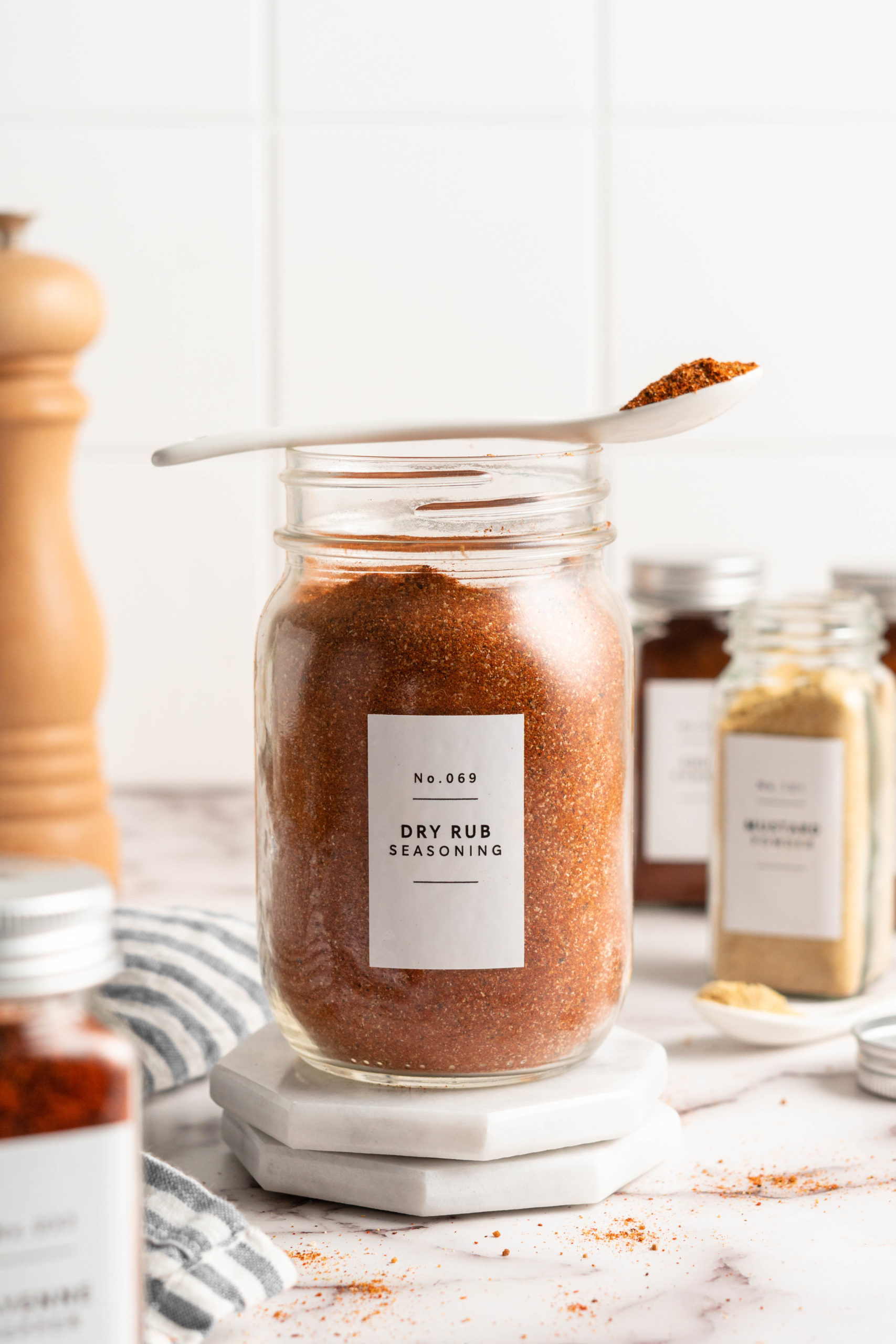 BBQ spice rub in jar with spoon set over top