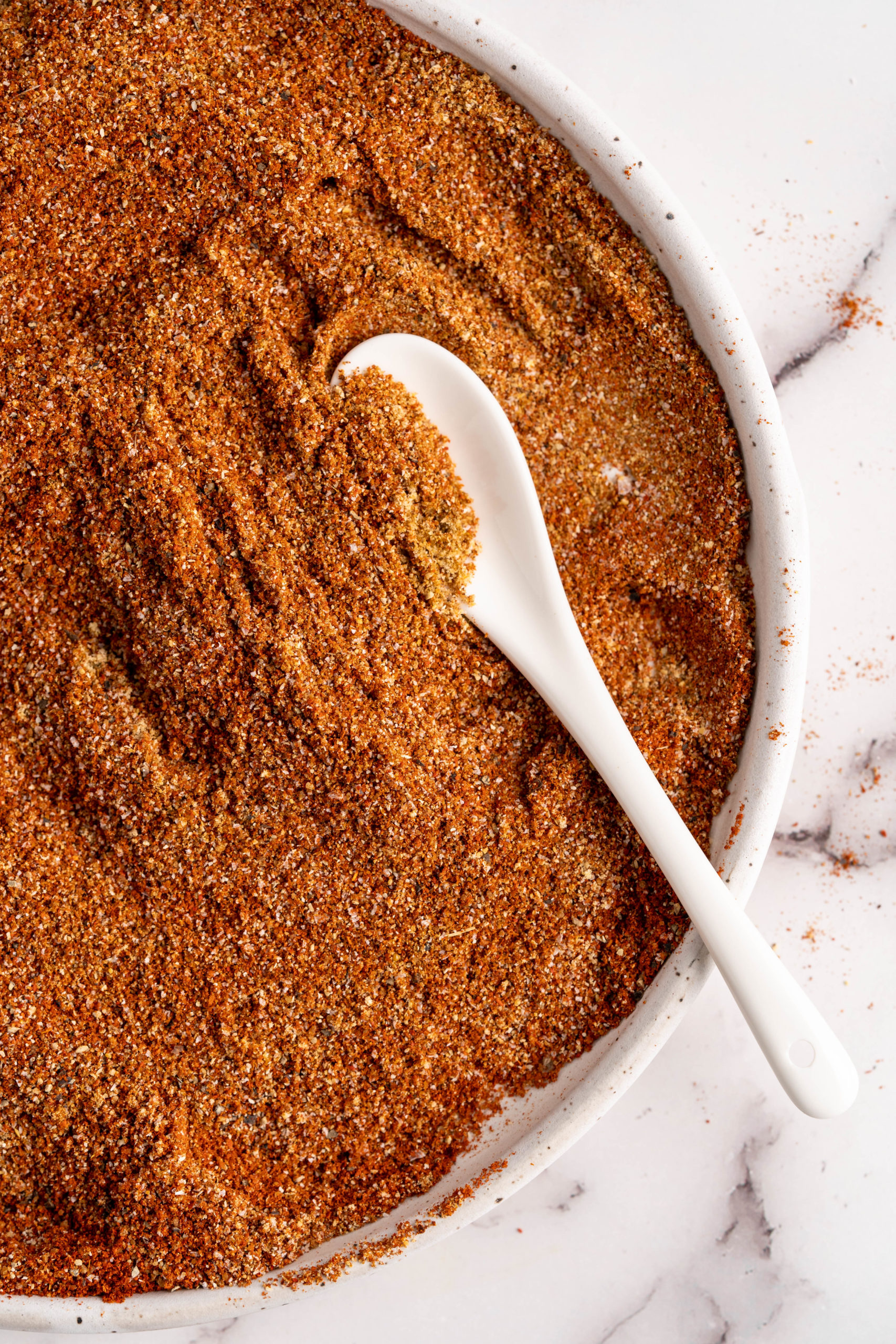 Large bowl of BBQ spice rub with spoon