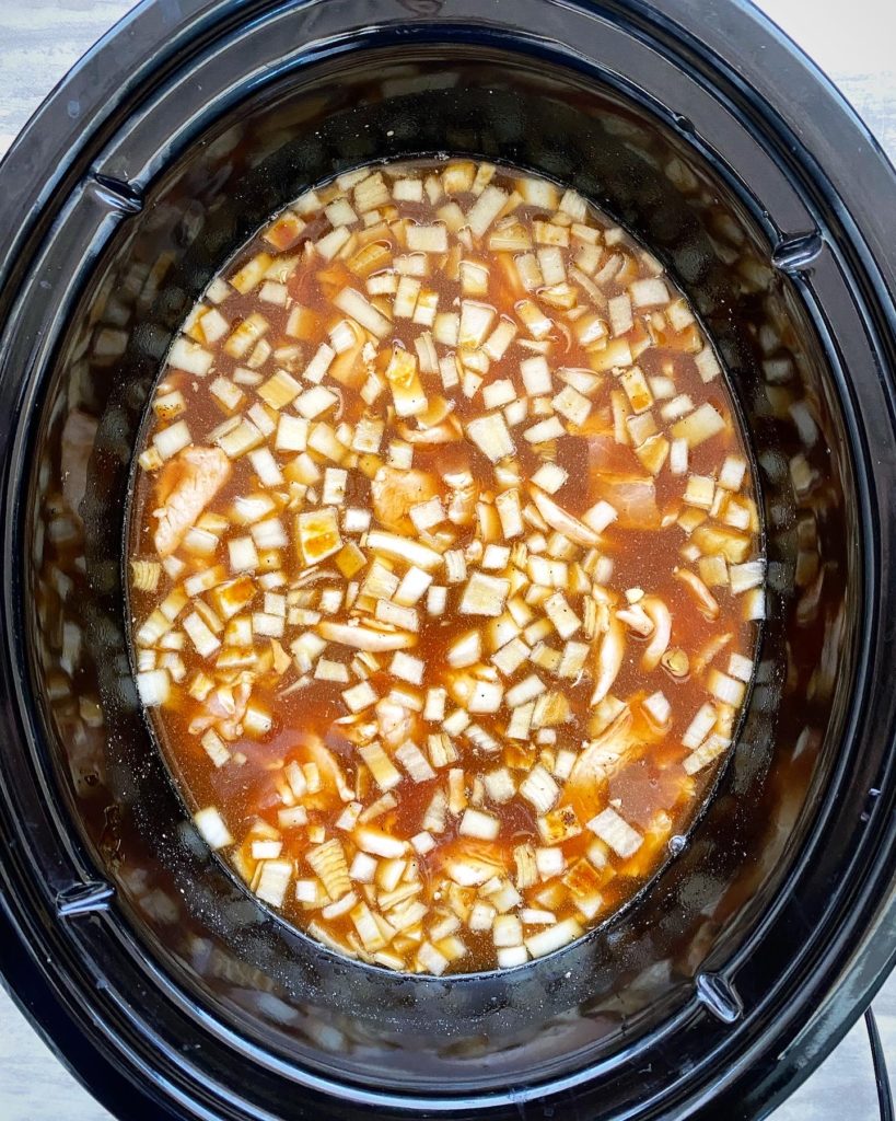 uncooked homemade baked beans in the slow cooker