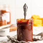 Barbecue sauce in jar with spoon