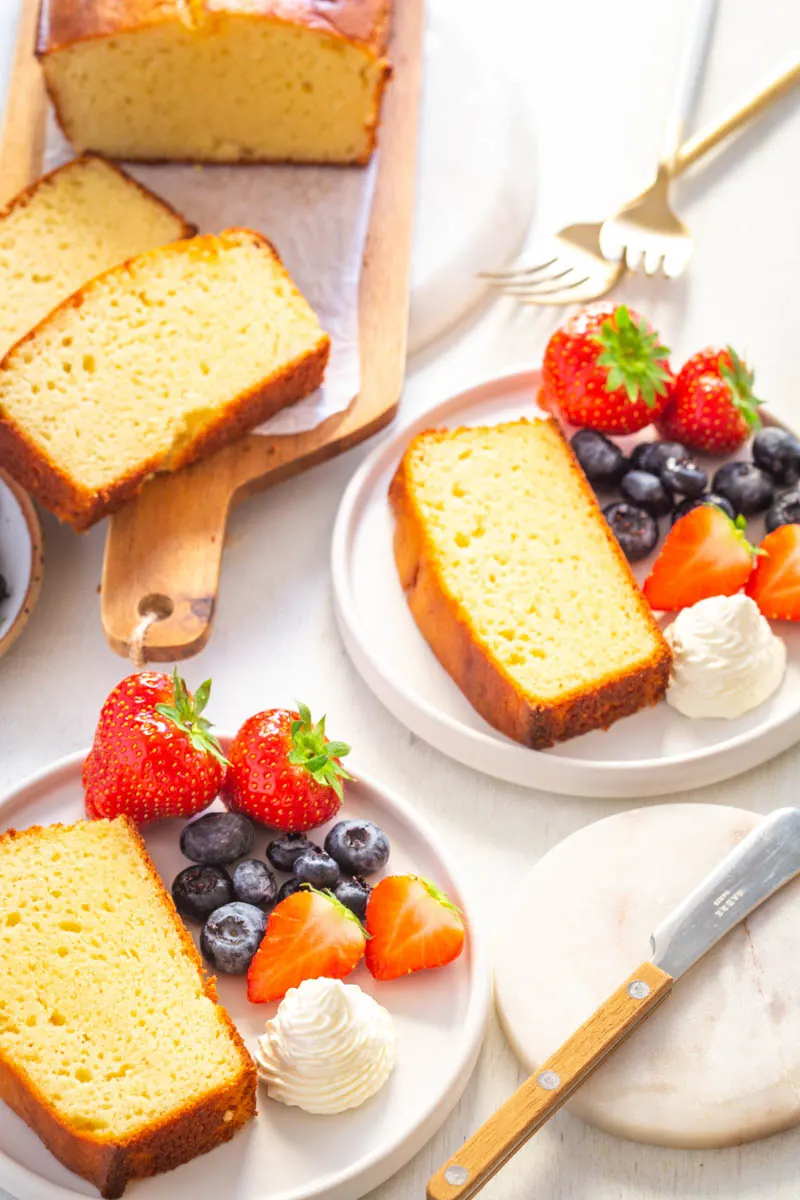 Low-carb pound cake with berries on a white plate