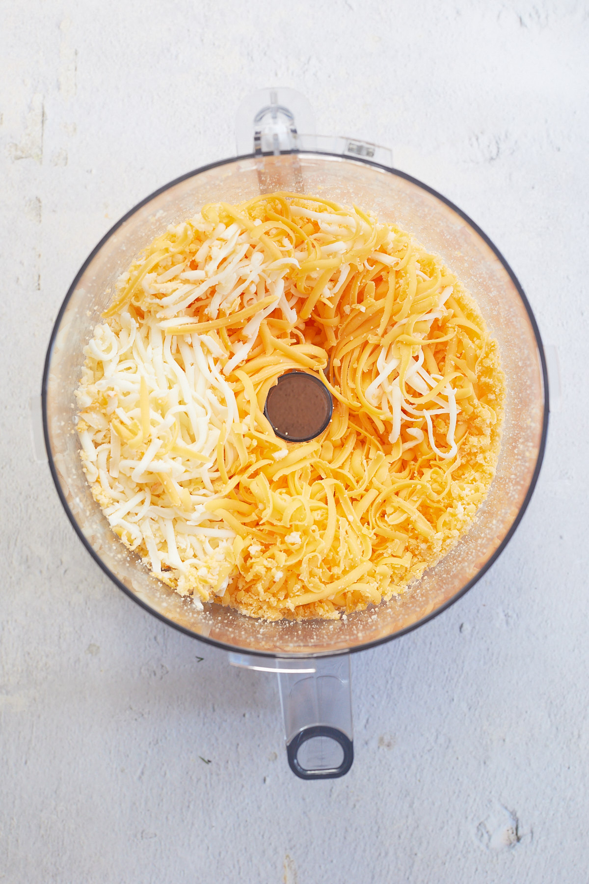 shredded cheese in a food processor