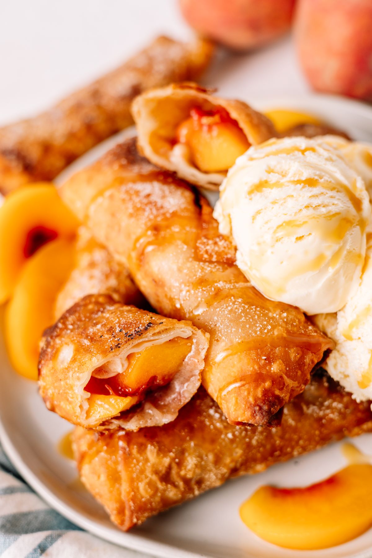 Peach Cobbler Egg Rolls with ice cream on the side