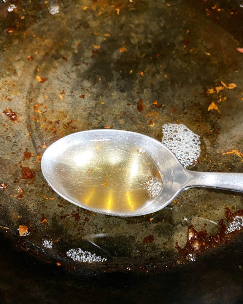 warm unfiltered bacon grease in a black skillet