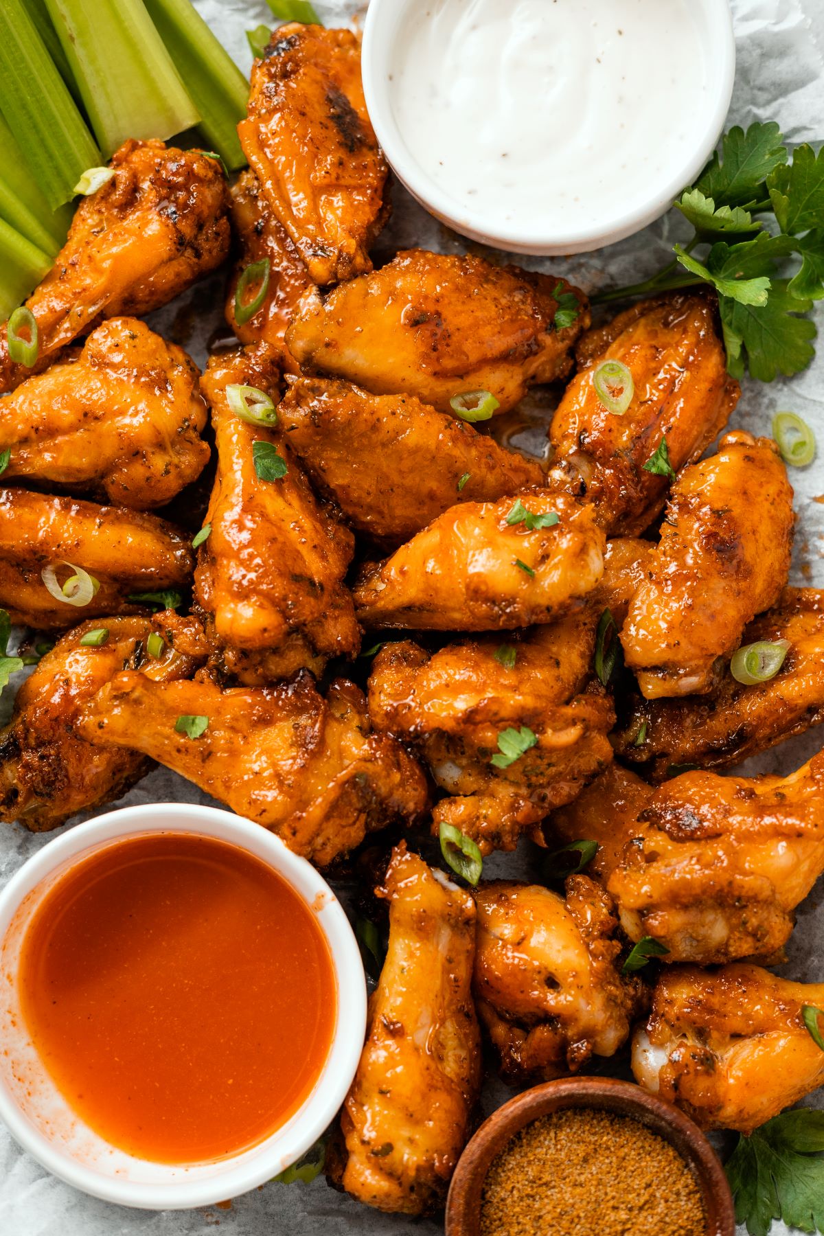 Hot Honey Old Bay Wings topped with green onions