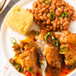 A plate of pig's feet, cornbread, and beans
