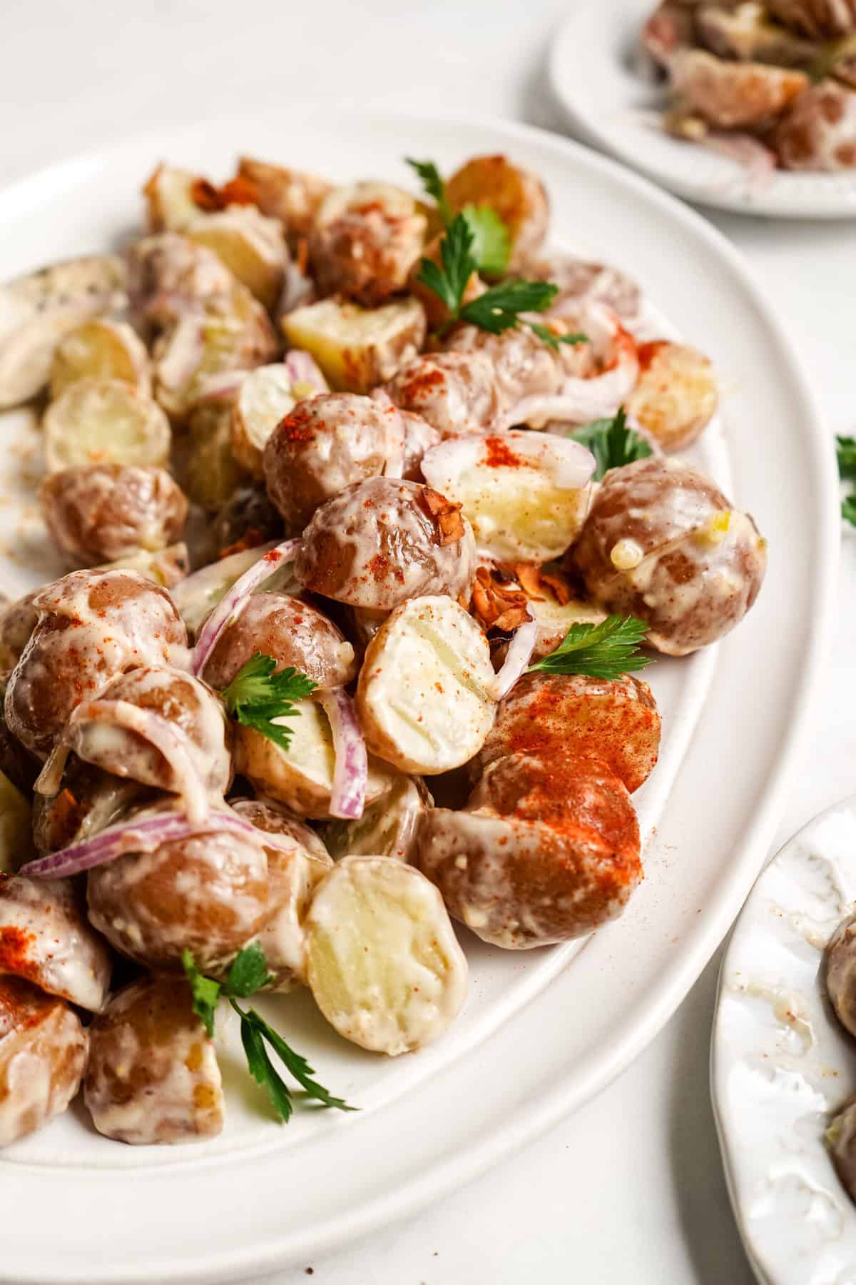 Vegan potato salad on white serving platter