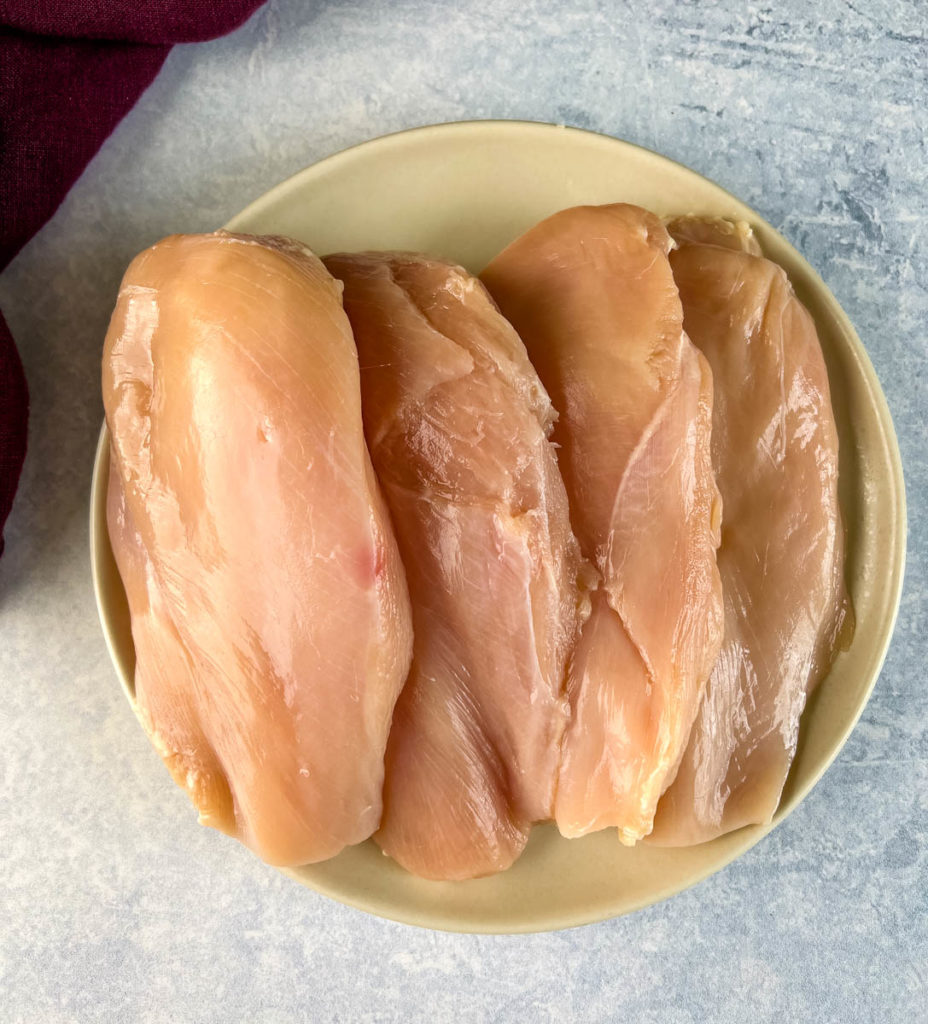 boneless skinless chicken breasts on a plate