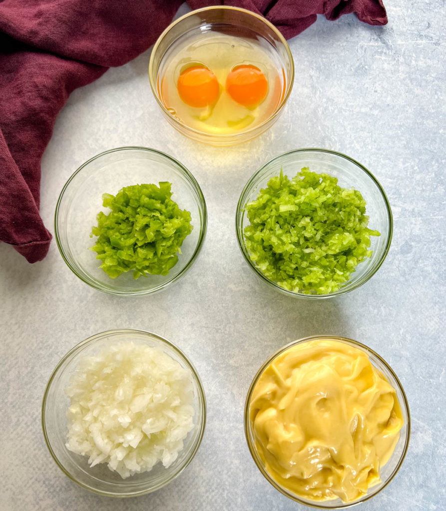 eggs, celery, onions, green peppers, and cream of chicken soup in separate bowls