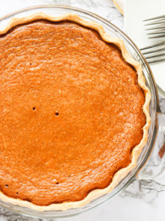A whole sweet potato pie fresh from the oven