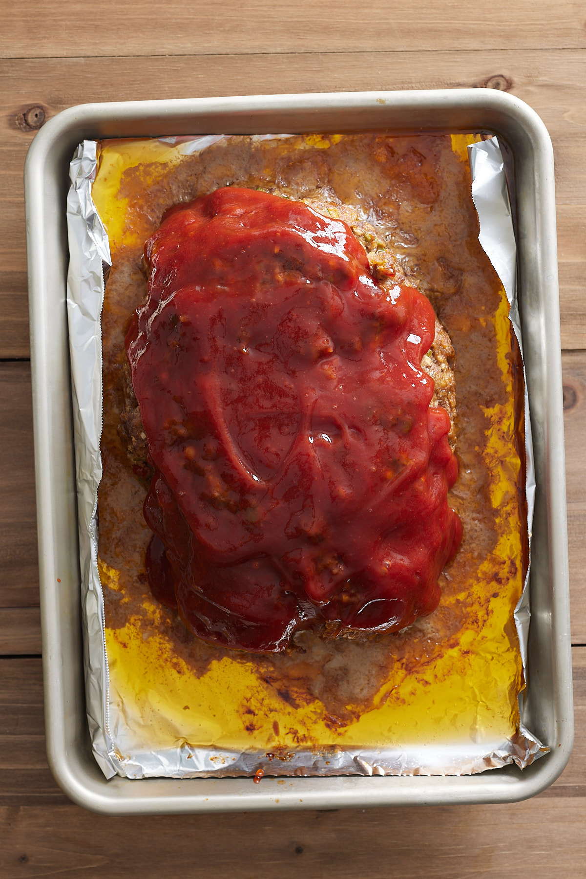 meatloaf covered in glaze before finished baking