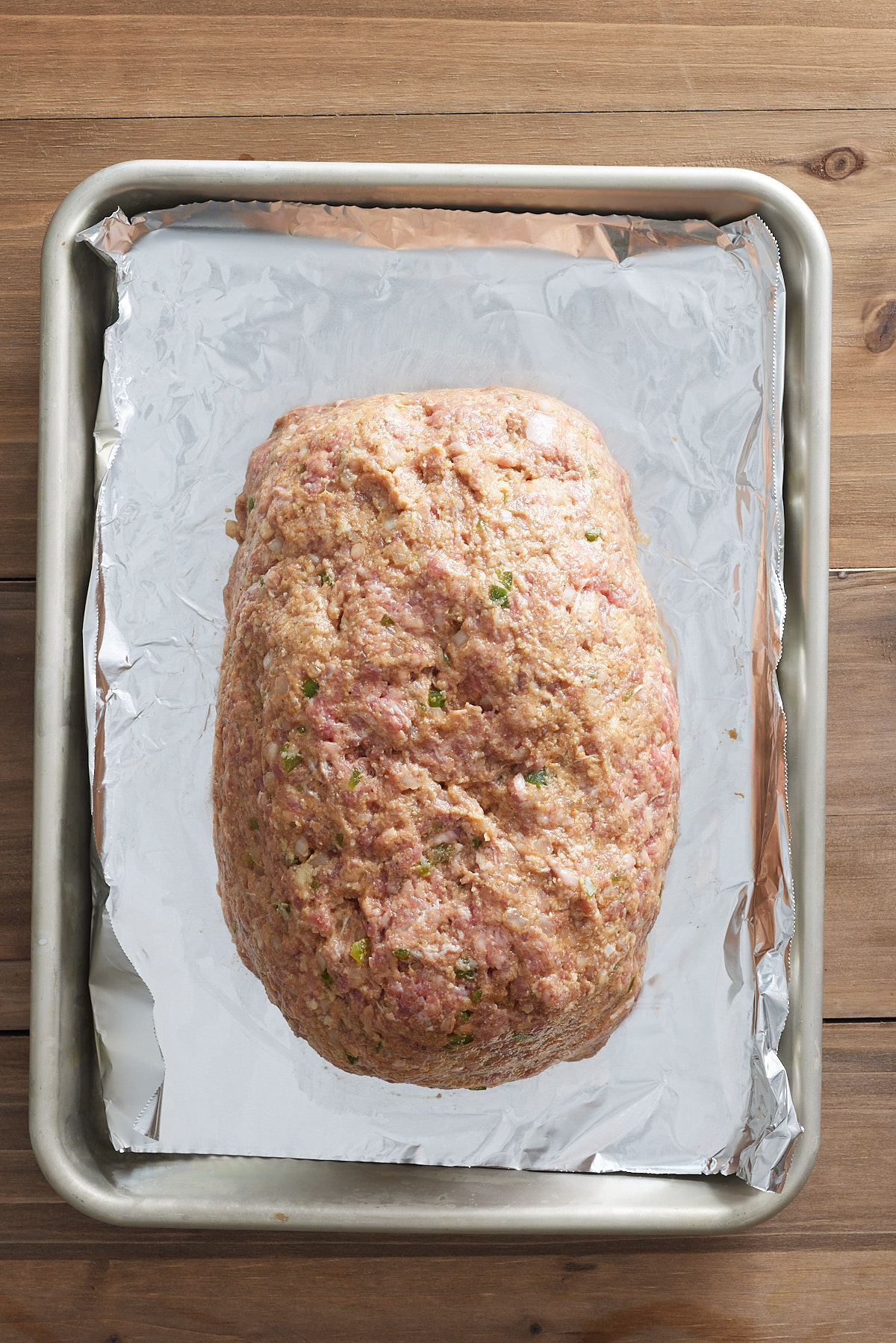 raw meatloaf on sheet pan