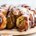 A close up of cinnamon roll monkey bread with pieces missing