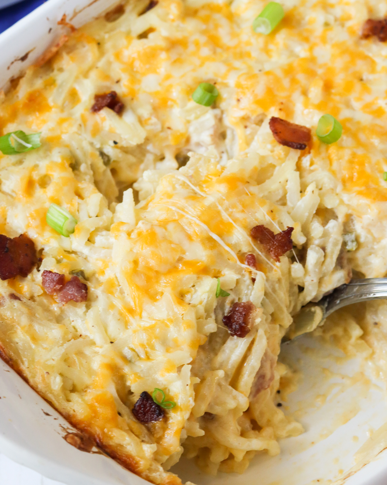 Serving mouthwatering cheesy hashbrown casserole
