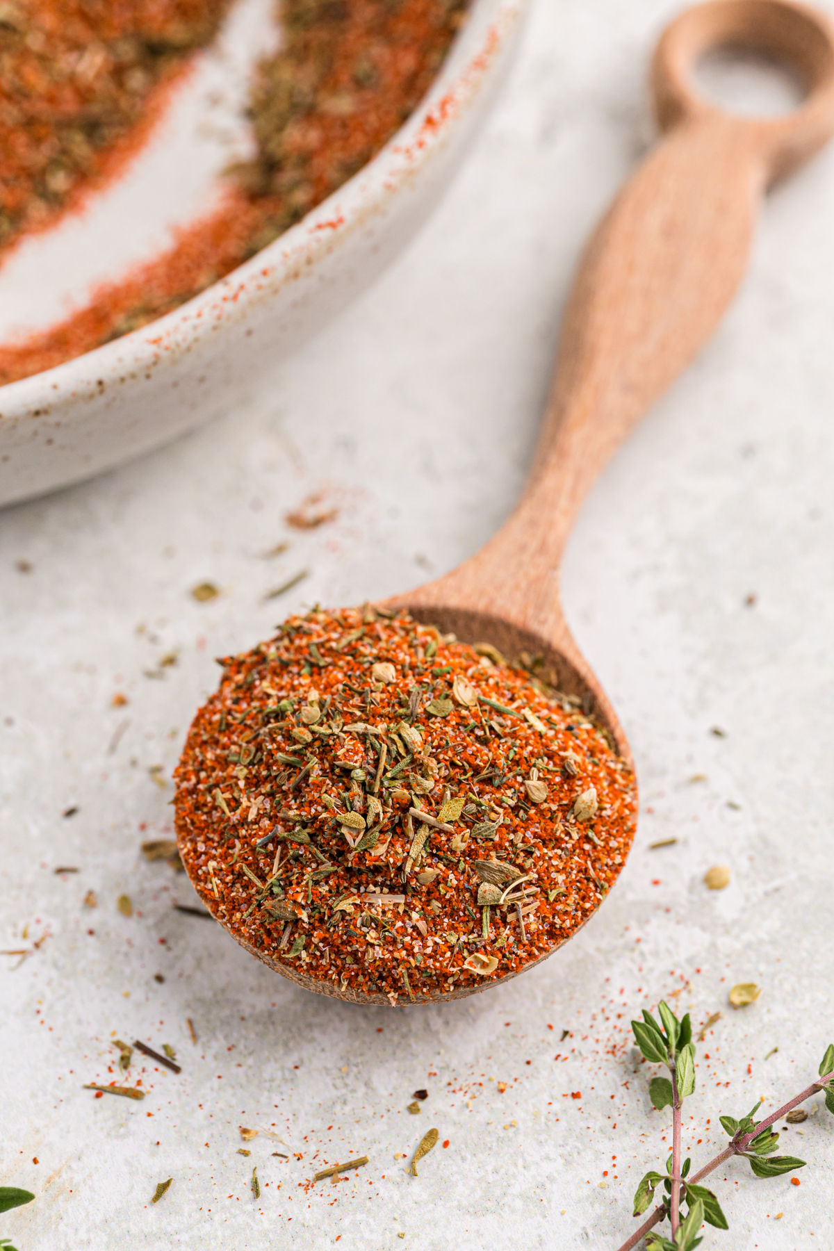 A large wooden spoon holding blackened seasoning