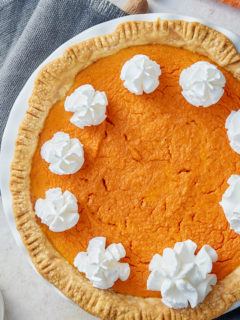 whole carrot pie with whipped cream on top