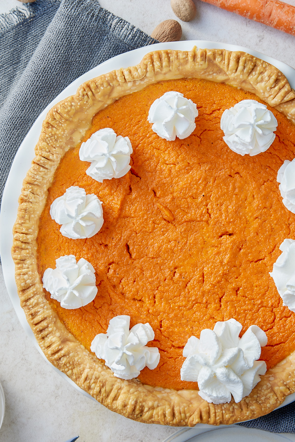 whole carrot pie with whipped cream on top