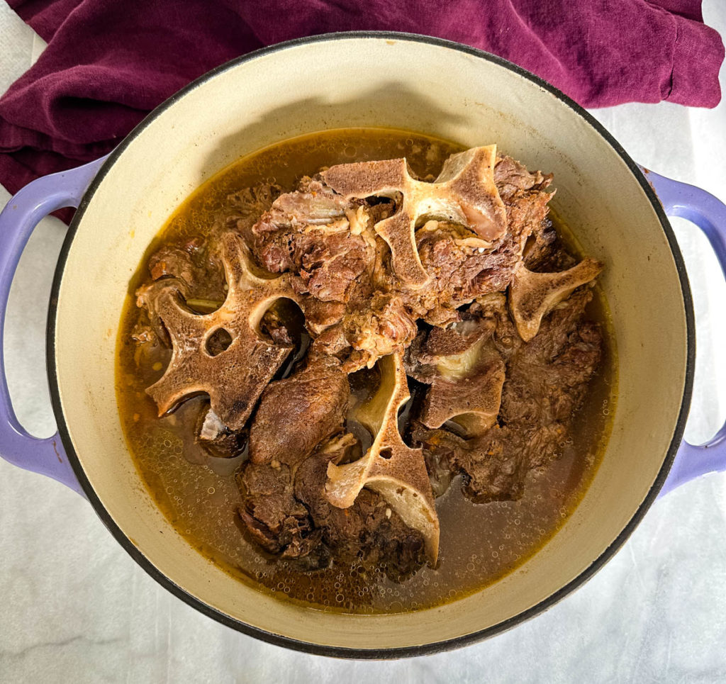 southern beef neck bones in a pot with broth