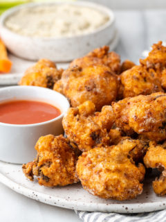Southern Fried Cauliflower on a plate with hot sauce