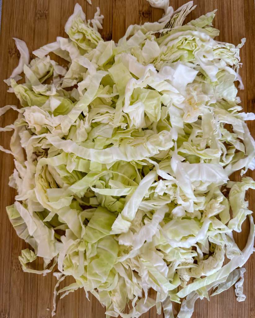 fresh sliced cabbage on a cutting board