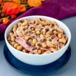 Southern black eyed peas with smoked turkey in a white bowl
