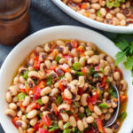 black eyed pea salad in bowl with spoon sticking out