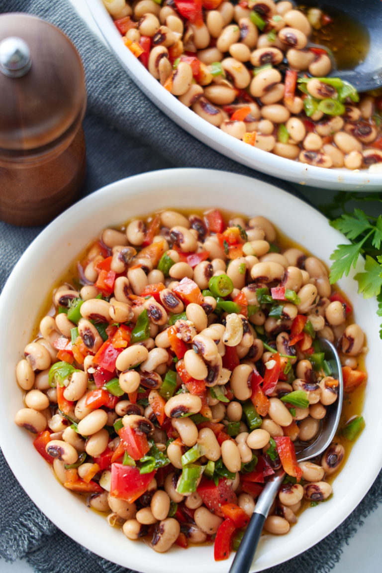 black eyed pea salad in bowl with spoon sticking out