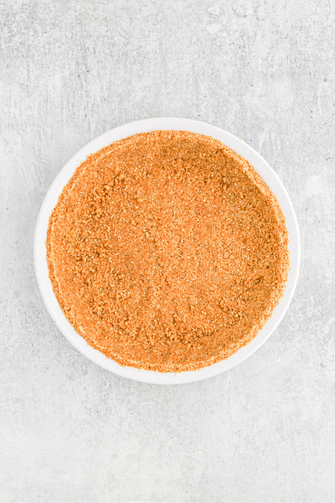 A graham cracker crust ready to fill