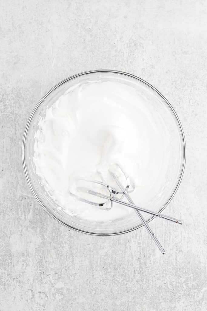 Whipped meringue in a glass bowl