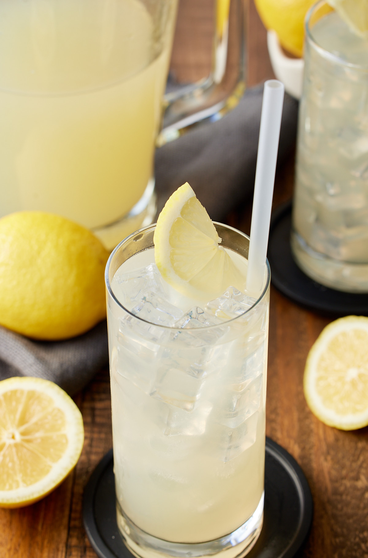 lemonade in glass in front of pitcher