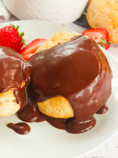 Freshly made chocolate gravy and biscuits with strawberries