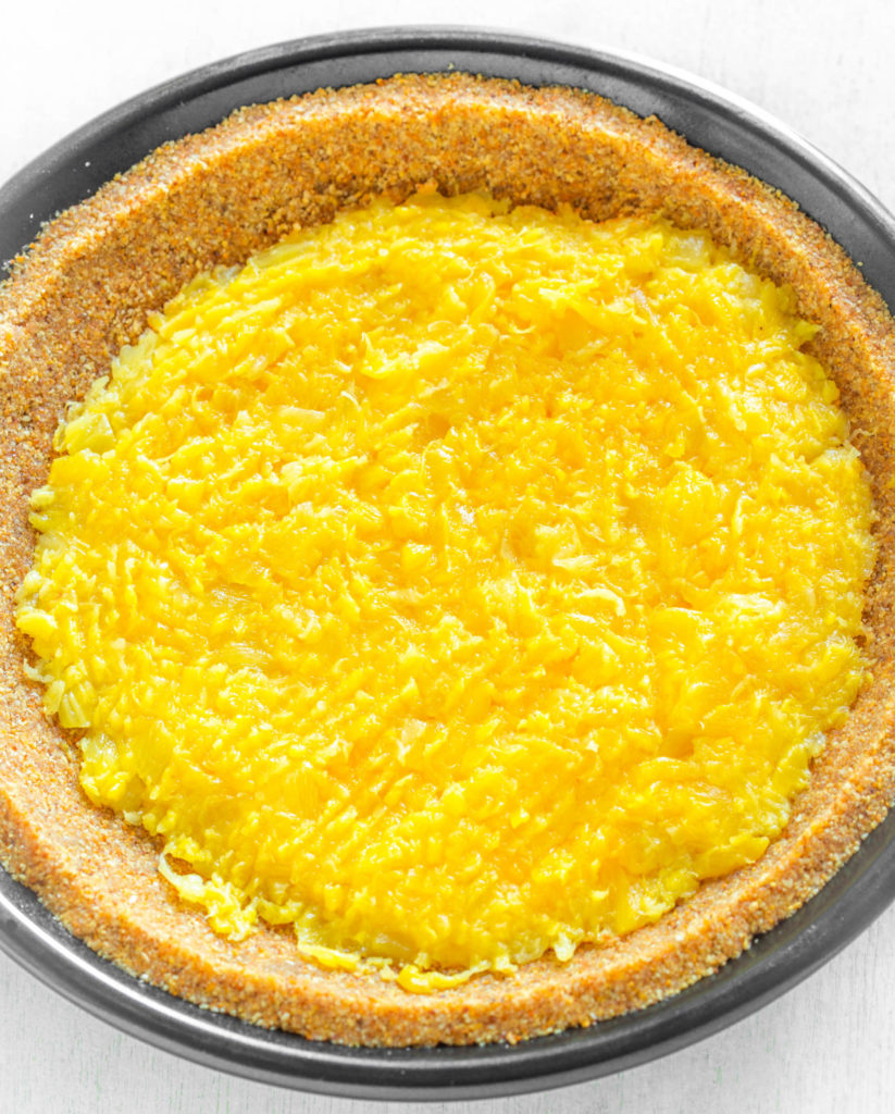 crushed pineapples on top of graham cracker pie crust