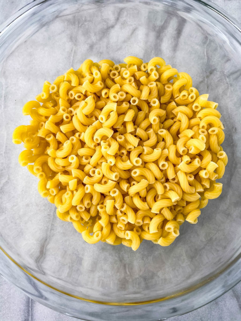cooked elbow macaroni pasta in a glass bowl
