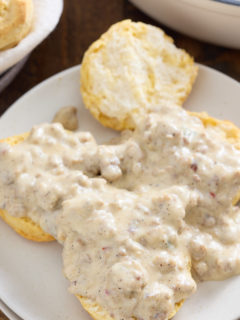 sausage gravy covering biscuits
