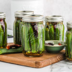 Sealed pint jars of pickled okra.