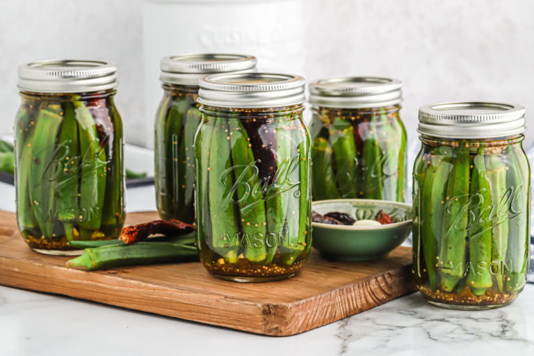 Sealed pint jars of pickled okra.