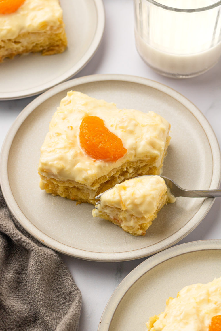 Fork cutting into slice of vegan pig pickin cake