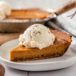 a slice of Sweet Potato Pie with Graham Crust topped with butter pecan ice cream