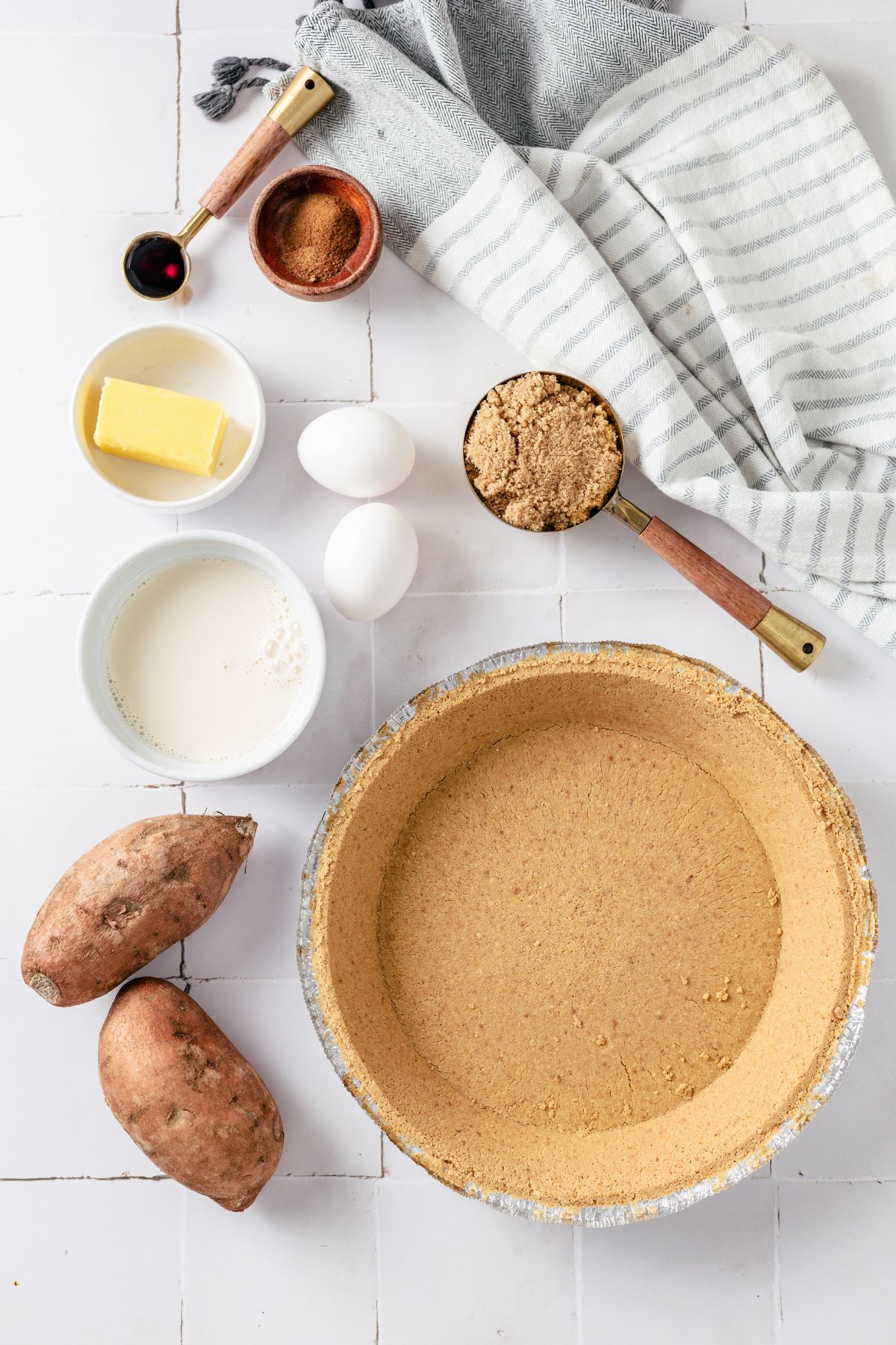 Graham cracker crust, Sweet potatoes, Butter, Brown sugar, Evaporated milk, cinnamon and nutmeg in separate containers