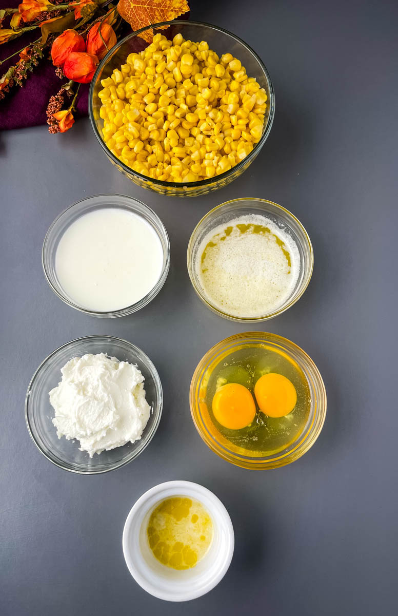 whole kernel corn, buttermilk, eggs, sour cream, and spices in separate glass bowls