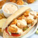 Serving up a soul-satisfying shrimp po boy sandwich with a side of spicy remoulade