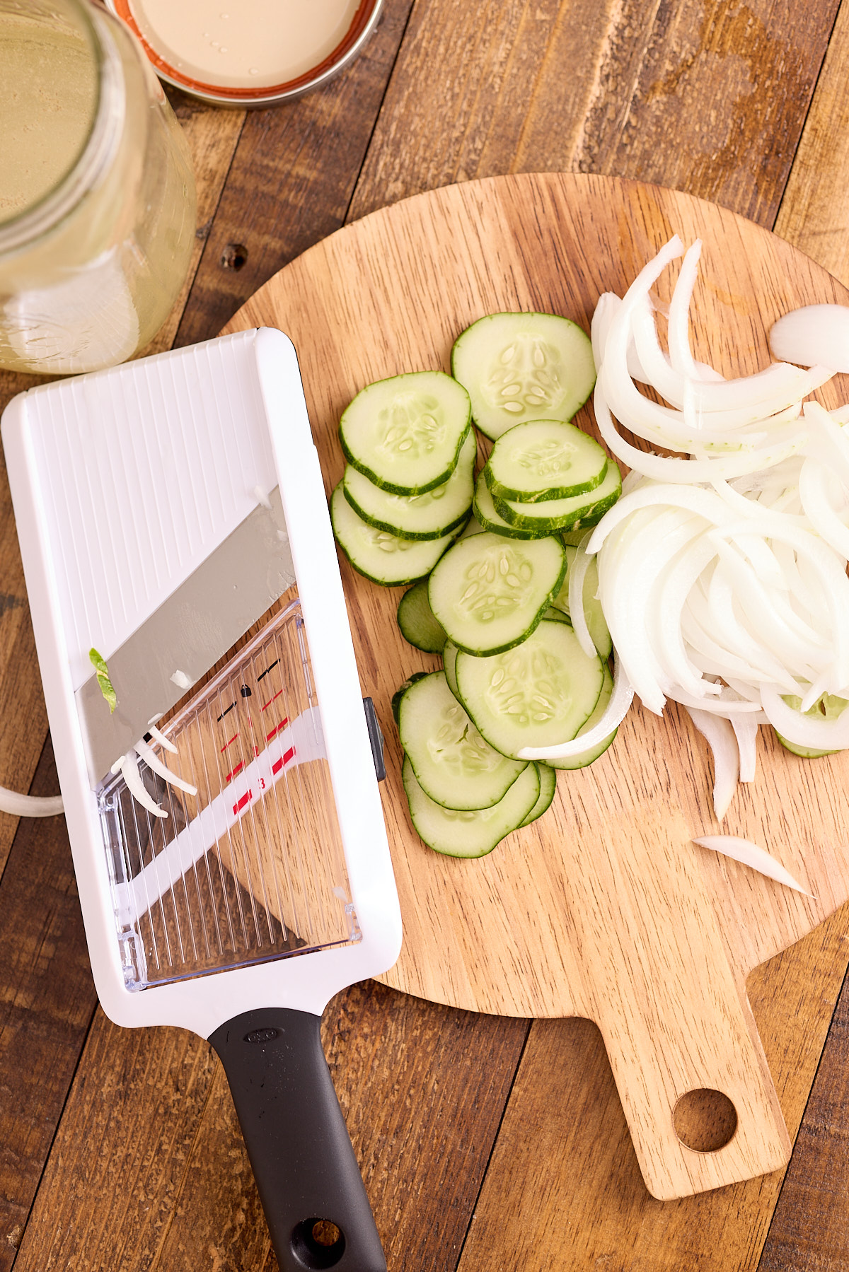 sliced cucumbers on cutting board