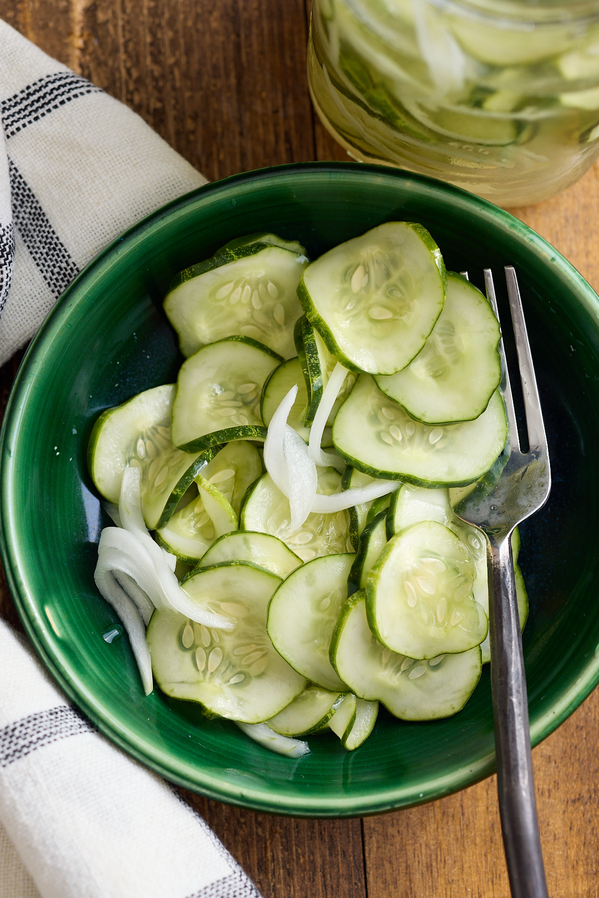 refrigerator pickles in bowl with fork sticking out